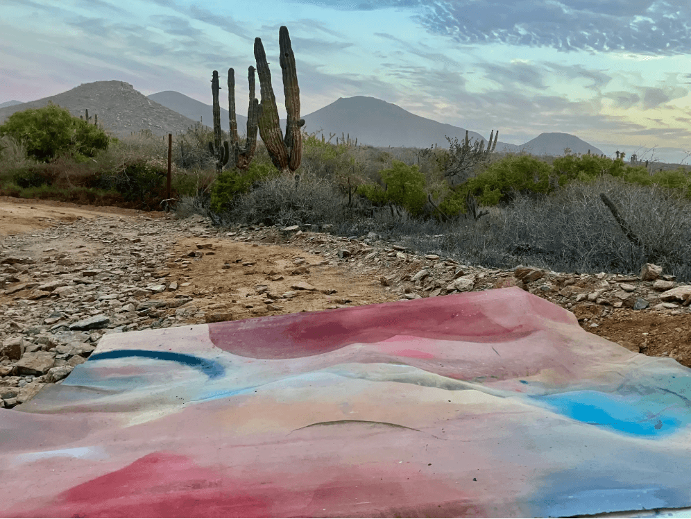 Landscape painting with desert and colorful abstract forms